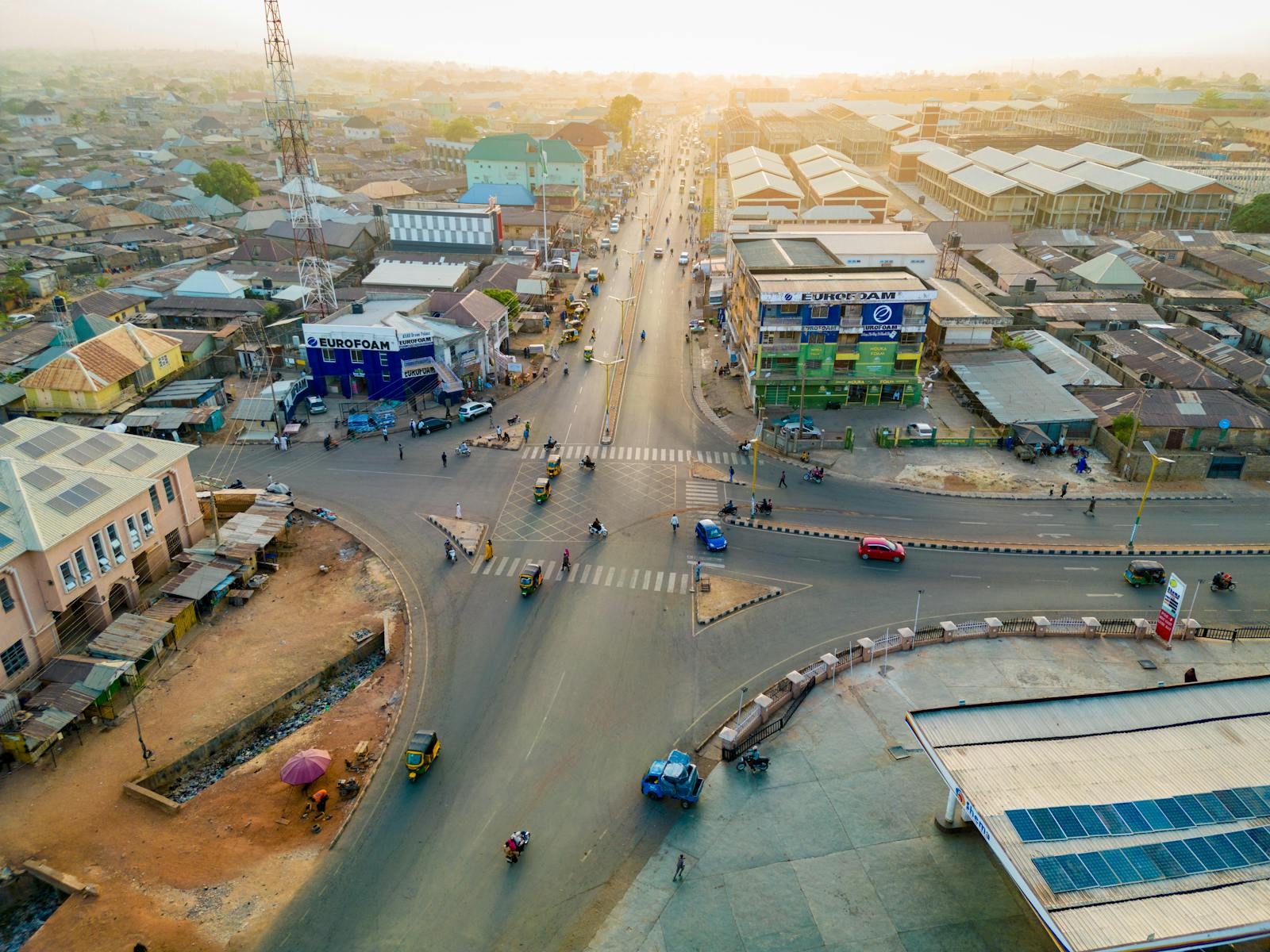 Stunning aerial capture of a bustling intersection in Kaduna, Nigeria during the day.