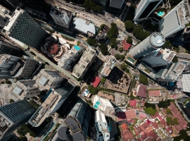 Stunning aerial photograph showcasing a bustling urban landscape with skyscrapers and city streets.