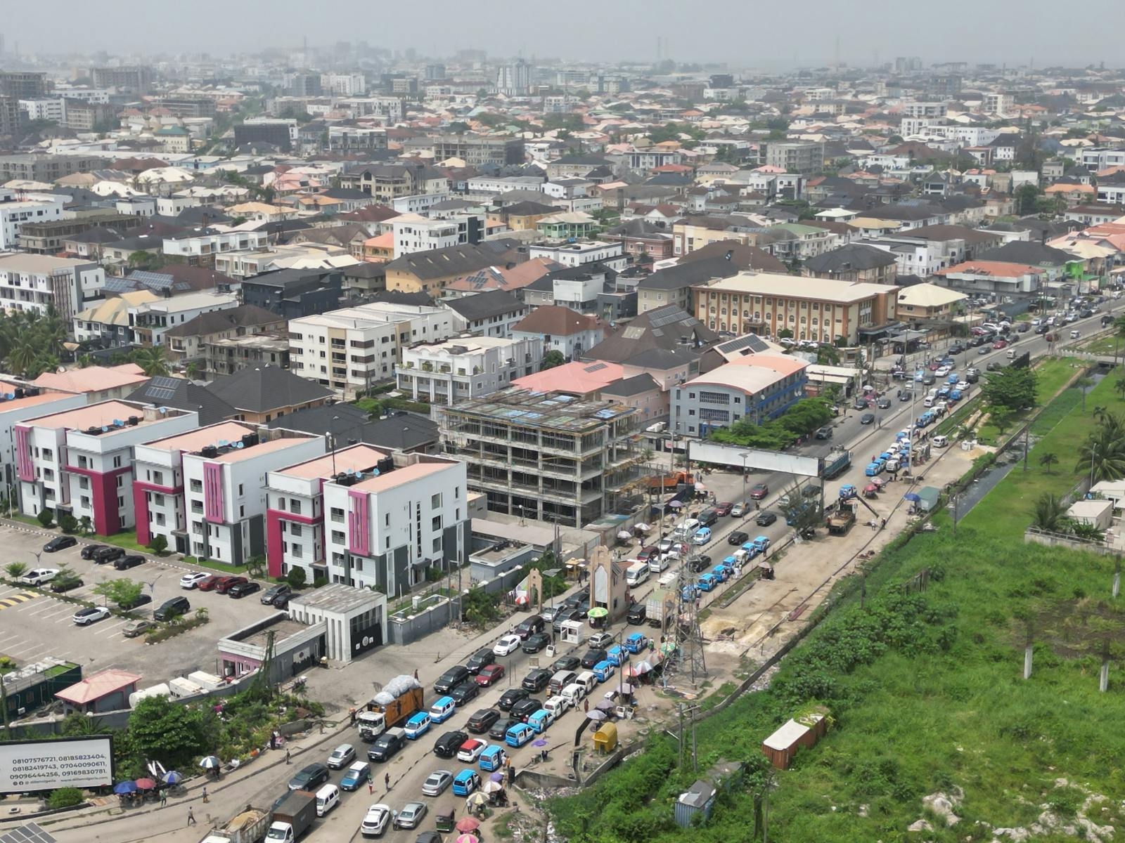 A bustling aerial view of Lagos, Nigeria showcasing dense urban architecture and busy traffic.