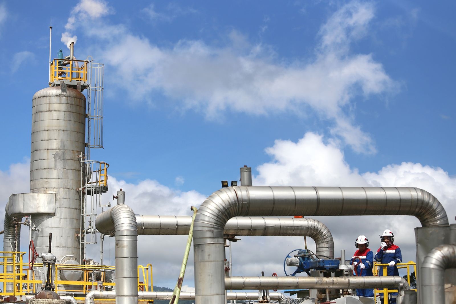 Modern gas plant operations with engineers in Lampung, Indonesia.